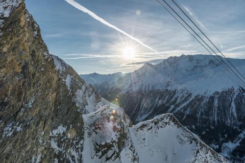 a view of a snowy mountain from a ski lift at Chalet Silvretta Hotel & Spa in Samnaun