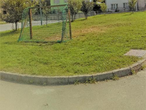 a batting cage on the side of a street at Studio apartment Meli in Ogulin
