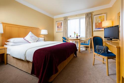 Krevet ili kreveti u jedinici u okviru objekta Dingle Bay Hotel