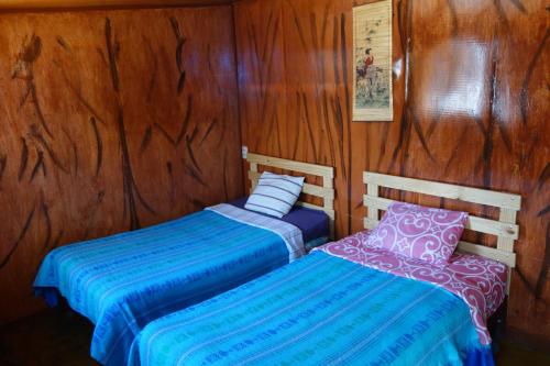 En eller flere senge i et værelse på La Casa de Chamo