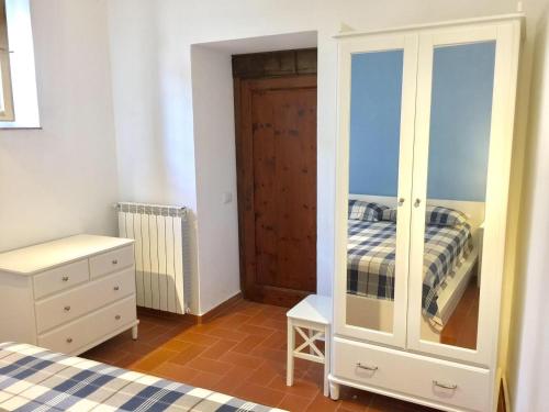 a bedroom with a bed and a dresser and a closet at DaLu Florence apartment Davide - private car park 15 minutes to the city center in Florence