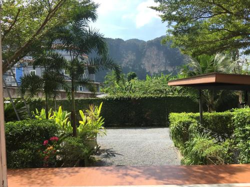 a garden with a view of a mountain at Siya Private Pool Villa Ao Nang in Ao Nang Beach