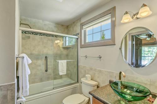 a bathroom with a shower and a toilet and a sink at Fish Creek Inn in Fish Creek