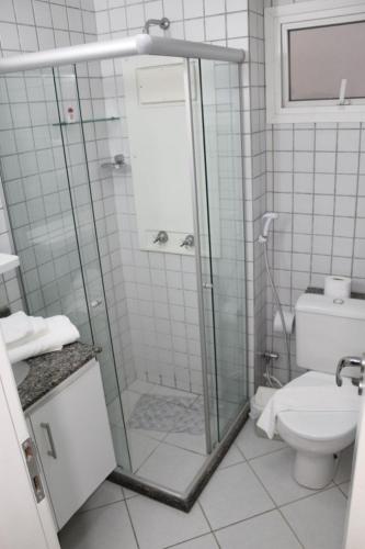 a bathroom with a shower and a toilet at Marina Bezerril - 304 Pontamares - Pertinho de tudo,mar e restaurantes in Natal