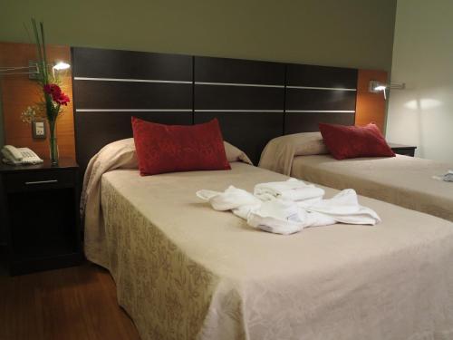 Postel nebo postele na pokoji v ubytování Hotel Corregidor