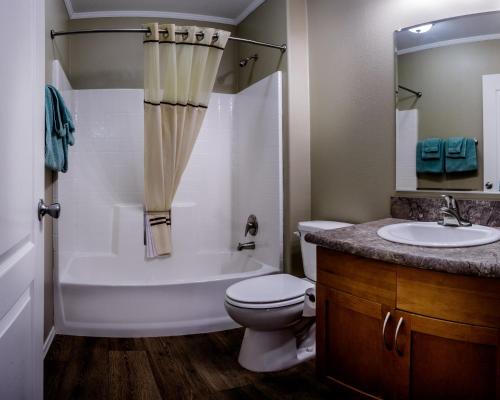 a bathroom with a tub and a toilet and a sink at Goulding's Lodge in Monument Valley