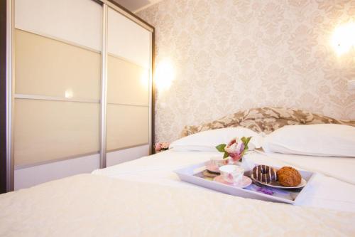 Postel nebo postele na pokoji v ubytování Apartments Paradise