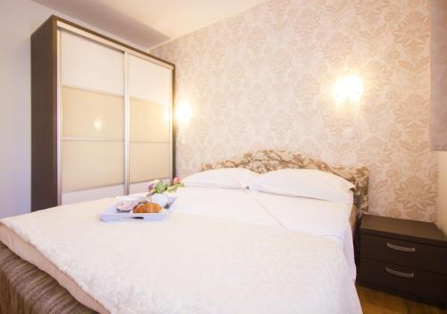 Postel nebo postele na pokoji v ubytování Apartments Paradise