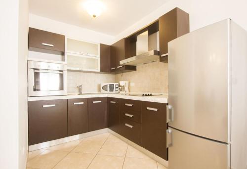 Kuchyň nebo kuchyňský kout v ubytování Apartments Paradise