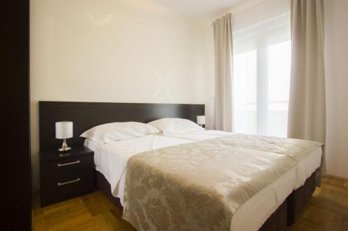 Postel nebo postele na pokoji v ubytování Apartments Paradise