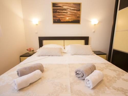 Postel nebo postele na pokoji v ubytování Apartments Paradise
