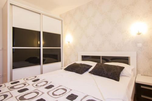 Postel nebo postele na pokoji v ubytování Apartments Paradise
