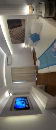 a room with a ceiling with a tablet in it at Cosmopolitan Hotel in Kos