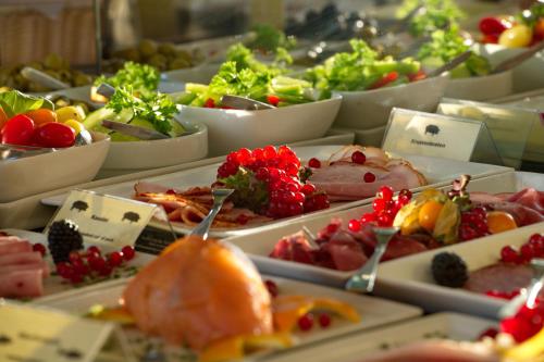 a buffet filled with many different types of food at Best Western Hotel Kaiserhof in Bonn
