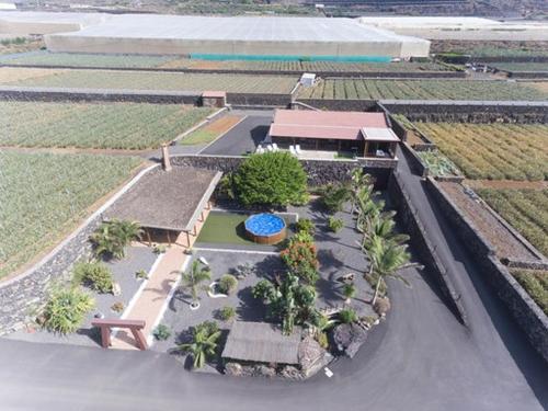 an aerial view of a resort with a pool at Villa Tejeguate in Frontera