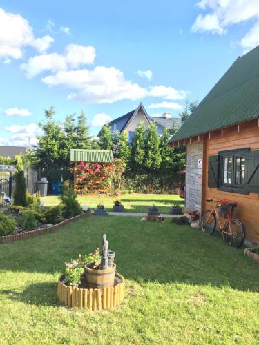 Taman di luar Domki Letniskowe Malinka Dąbki Bobolin