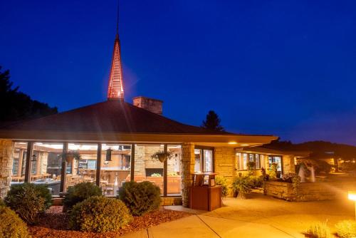 a building with a tower on top of it at night at Spring Valley Inn in Spring Green