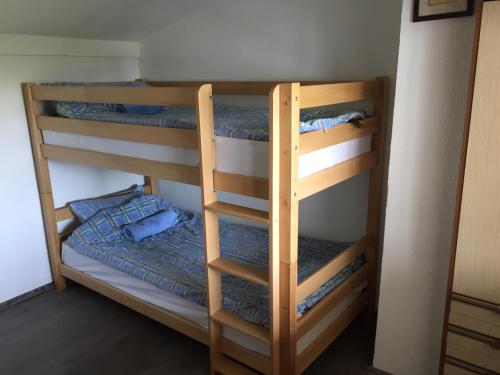 two sets of bunk beds in a room at Kitka Hostel - Guest House in Tetovo