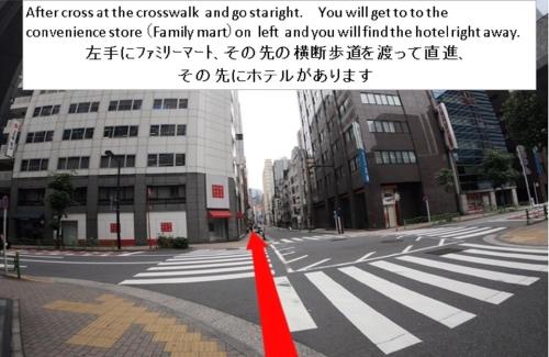 an empty street with a red line on the road at Hotel Sunroute Ginza in Tokyo
