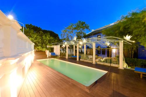 a swimming pool in the backyard of a house at Cheong Fatt Tze - The Blue Mansion in George Town