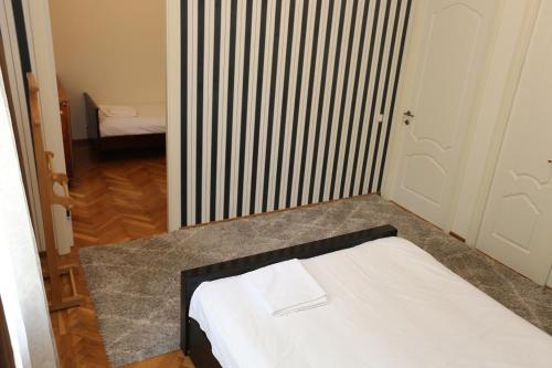 Guest House Pirosmani 60にあるベッド