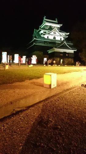a white box sitting on the side of a road at night at 縁の宿 北堀 in Matsue