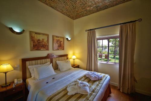 Lova arba lovos apgyvendinimo įstaigoje Vila Alba Resort