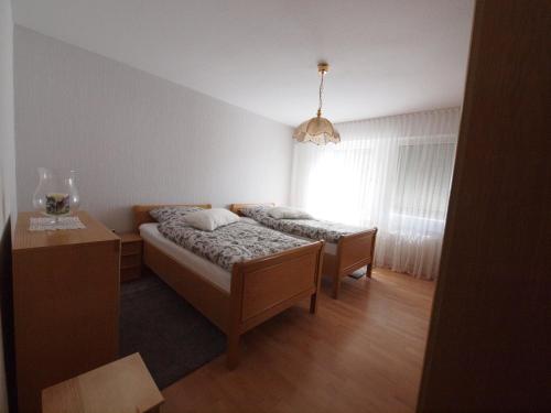 a small bedroom with a bed and a window at Am Klinikum in Solingen