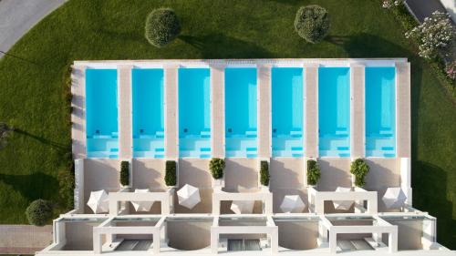 an overhead view of a white building with blue windows at Apollo Blue in Faliraki