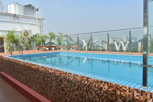 a large swimming pool on top of a building at Hotel Shwe Yee in Yangon