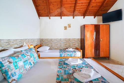 Ένα ή περισσότερα κρεβάτια σε δωμάτιο στο Avgoustos Beach House