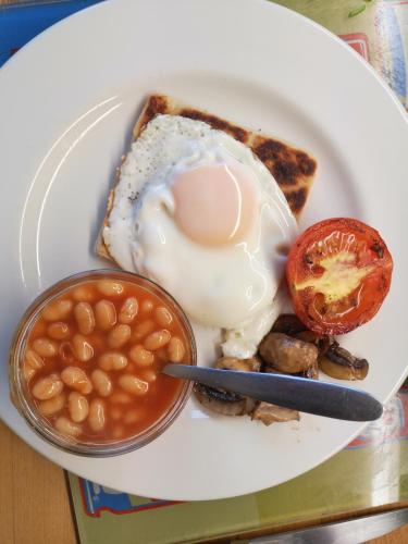 a plate of food with an egg and beans at Dunagree Bed & Breakfast in Greencastle