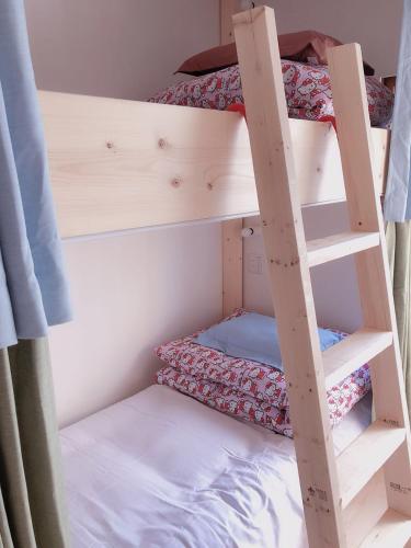Postel nebo postele na pokoji v ubytování Guest House Ringo