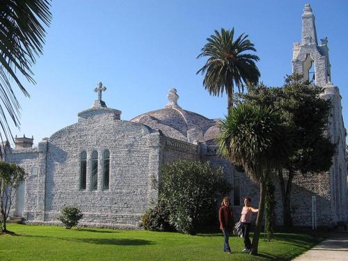 two people standing in front of a church at Hotel La Noyesa *** Superior in O Grove