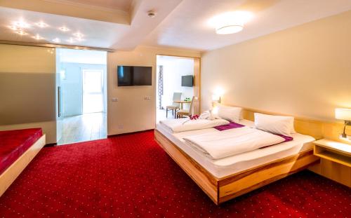Un ou plusieurs lits dans un hébergement de l'établissement Panorama Hotel Traunstein