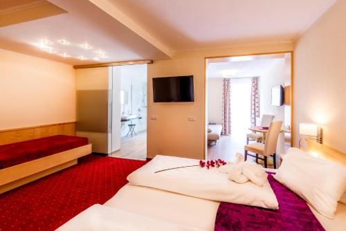 Un ou plusieurs lits dans un hébergement de l'établissement Panorama Hotel Traunstein
