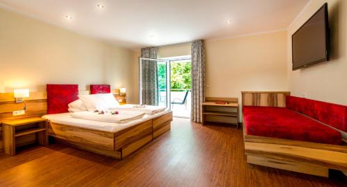 Un ou plusieurs lits dans un hébergement de l'établissement Panorama Hotel Traunstein