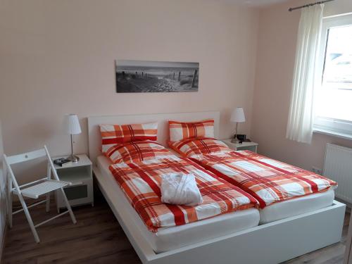 Ліжко або ліжка в номері Ferienwohnung Sommerwind