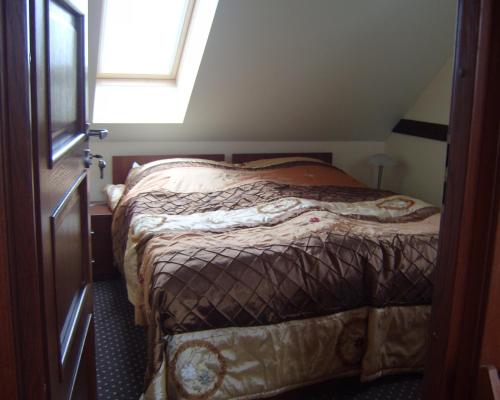 Ένα ή περισσότερα κρεβάτια σε δωμάτιο στο Willa Lawenda