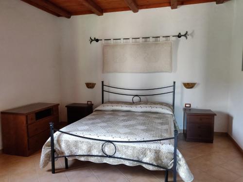 Ένα ή περισσότερα κρεβάτια σε δωμάτιο στο Casa Pinella