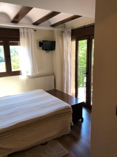 Casa del Arco tesisinde bir odada yatak veya yataklar