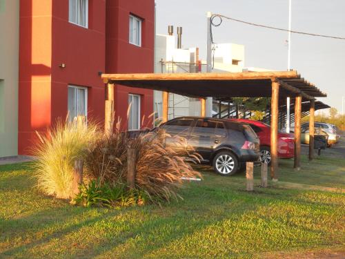 a car parked in a parking lot next to a building at 5 SOLES CHAJARI in Chajarí