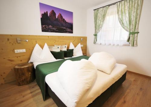 Postel nebo postele na pokoji v ubytování Residenz Erschbaum