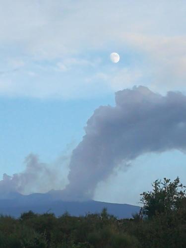 a cloud formation with the moon in the sky at Casa etna in Bronte