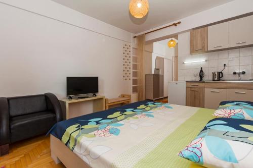 Llit o llits en una habitació de Etaksimo Central Apartment