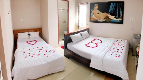 Giường trong phòng chung tại Ban Mai Hotel 66