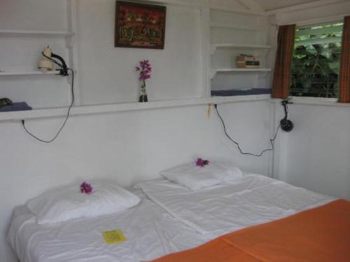 Postel nebo postele na pokoji v ubytování El Momo Cottages