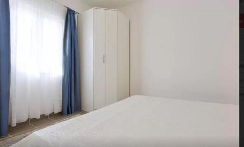 Katil atau katil-katil dalam bilik di Marija Apartment