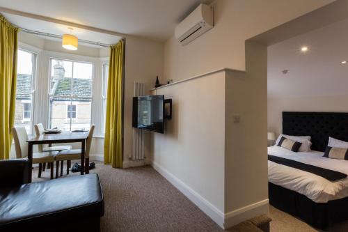 Postel nebo postele na pokoji v ubytování Ethos Hotel