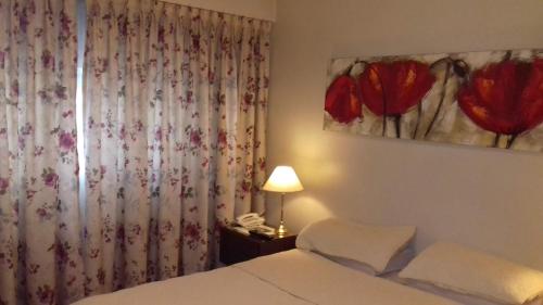 Postel nebo postele na pokoji v ubytování Departamento Belgrano